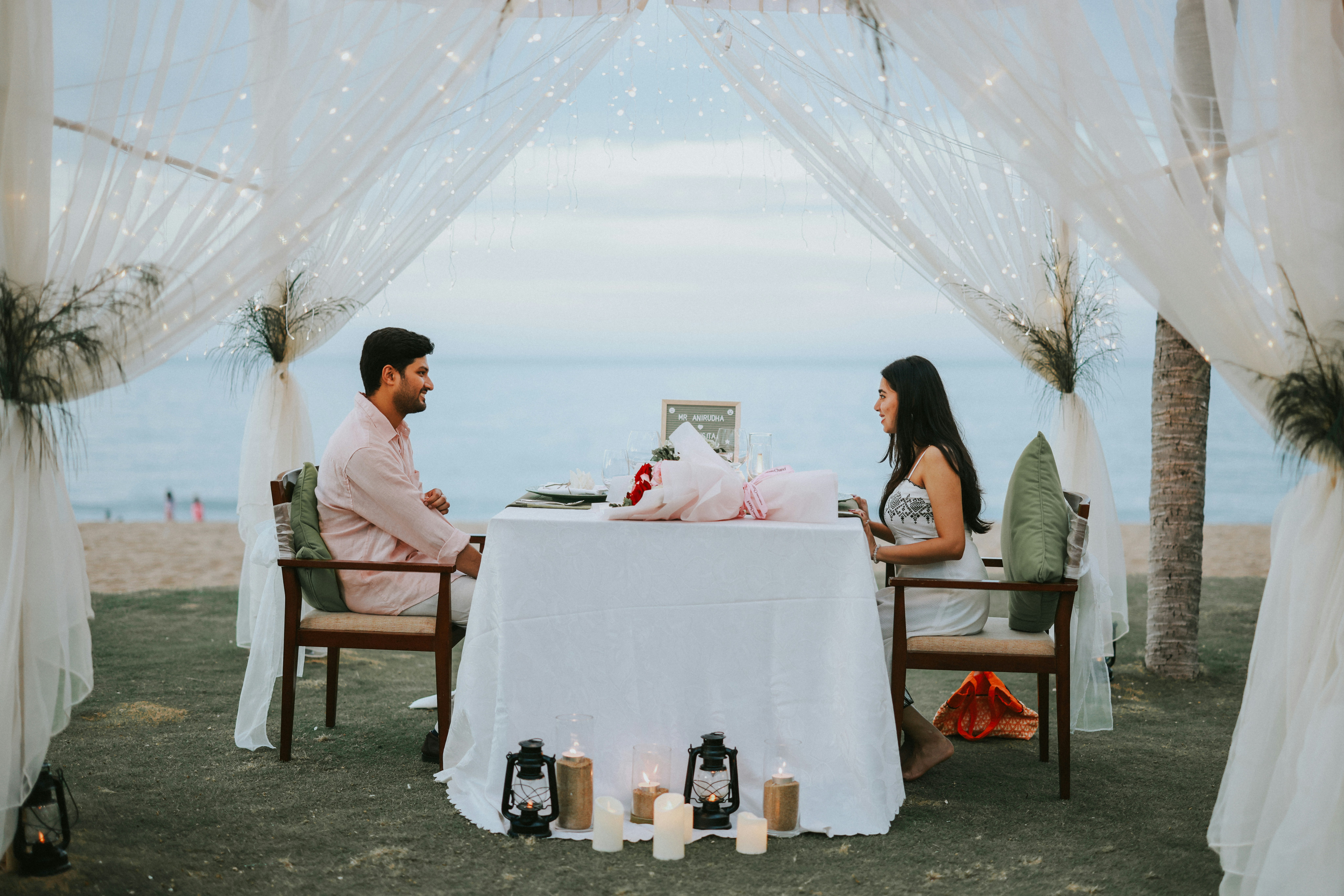 Couple dining together for Sunny Escape Travel romantic getaway planning