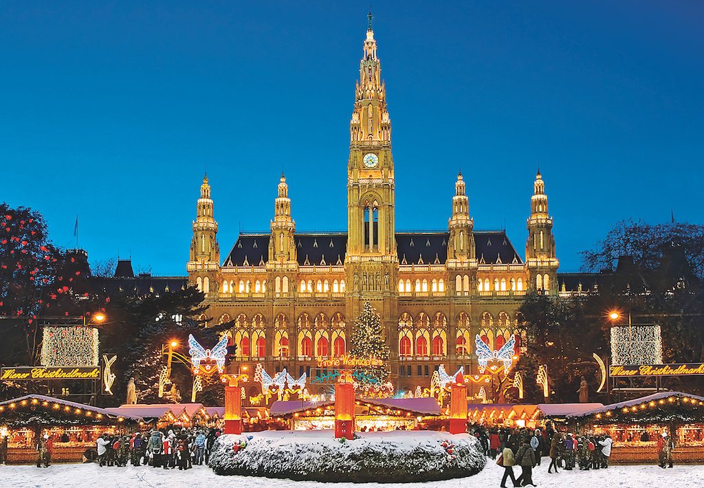 European Christmas market stalls lit up in the evening