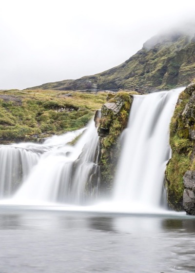 Iceland waterfall and rugged landscape