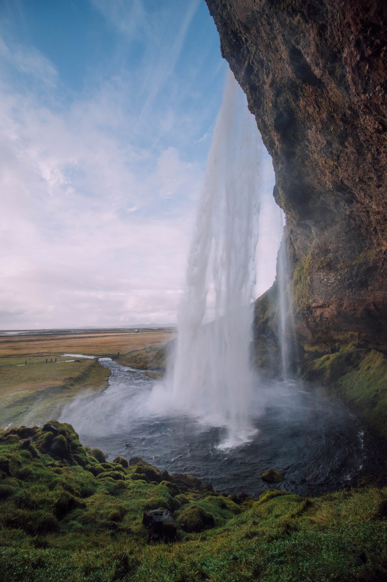 Iceland waterfall and rugged green landscape