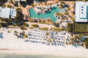 All-inclusive tropical resort pool and guest rooms