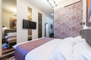 Luxury hotel room with white bedding and city view
