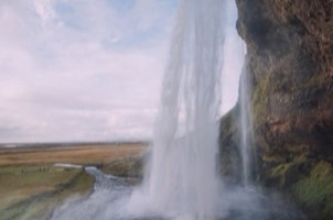 Iceland waterfall and rugged green landscape